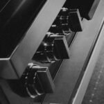 Close up of oven control knobs on a stainless range