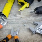 Appliance repair tools laid out on a workbench